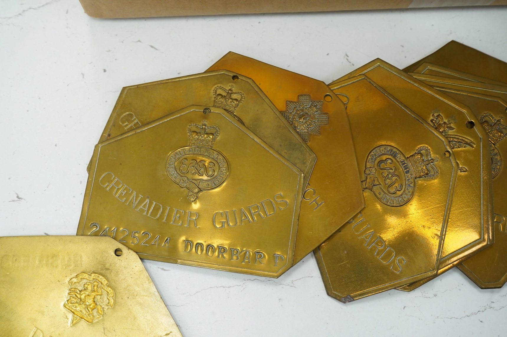 A collection of militaria, etc. including; a Gordon Highlander’s kilt and sporran, three early 20th century Union Flags, a Victorian beaded ‘sweetheart’s’ cushion, two empty First World War Princess Mary Christmas tins,